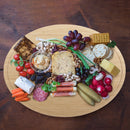 bamboo grooved oval cutting and serving board lifestyle crackers meats and cheese