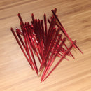 4.5" red prism plastic skewer picks on bamboo wood