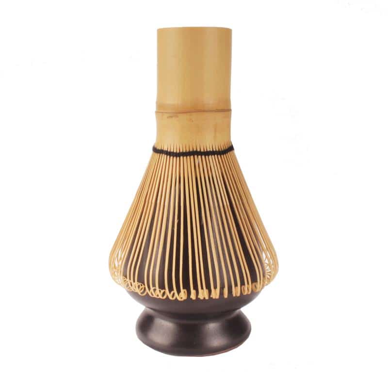 matcha rest holding tea whisk