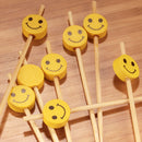 smiley face yellow smile bamboo picks closeup